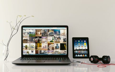 A modern executive workstation with a laptop open to a clean calendar schedule display