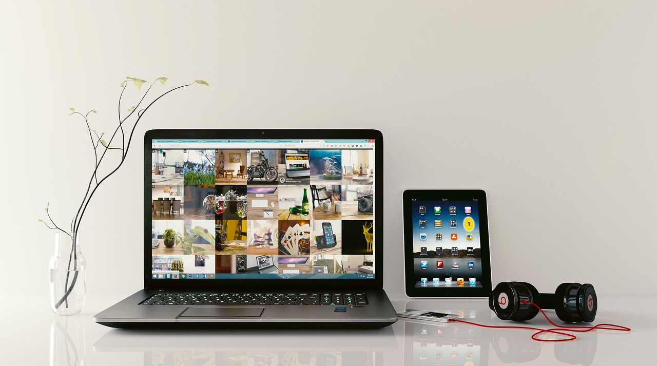 A modern executive workstation with a laptop open to a clean calendar schedule display
