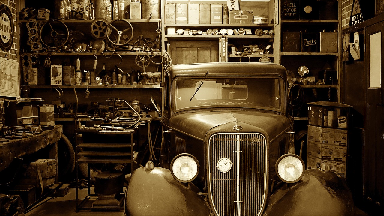 A high-end modified vehicle parked inside a clean professional automotive workshop.