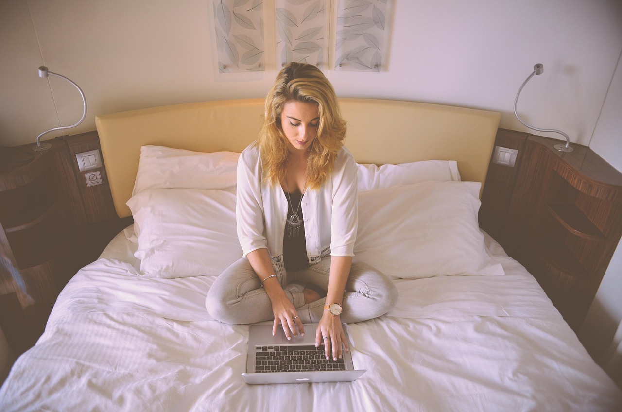 Young adult working on a laptop computer at a desk
