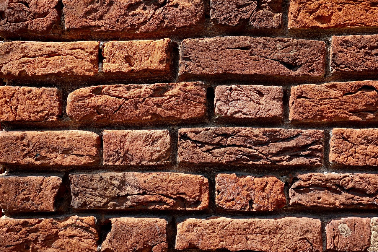 Applying breathable masonry water repellent to exterior brick wall