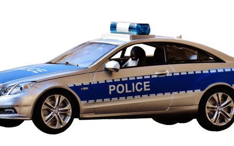 A retired police cruiser parked in a municipal surplus auction lot.