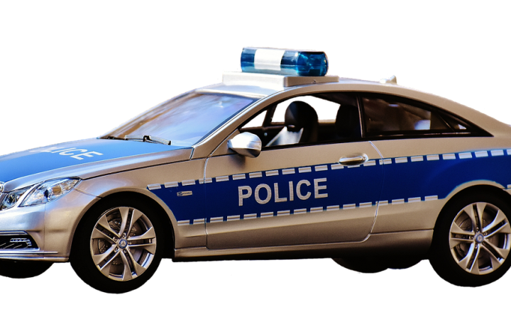 A retired police cruiser parked in a municipal surplus auction lot.