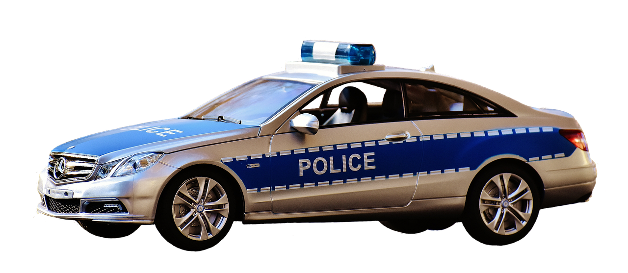 A retired police cruiser parked in a municipal surplus auction lot.
