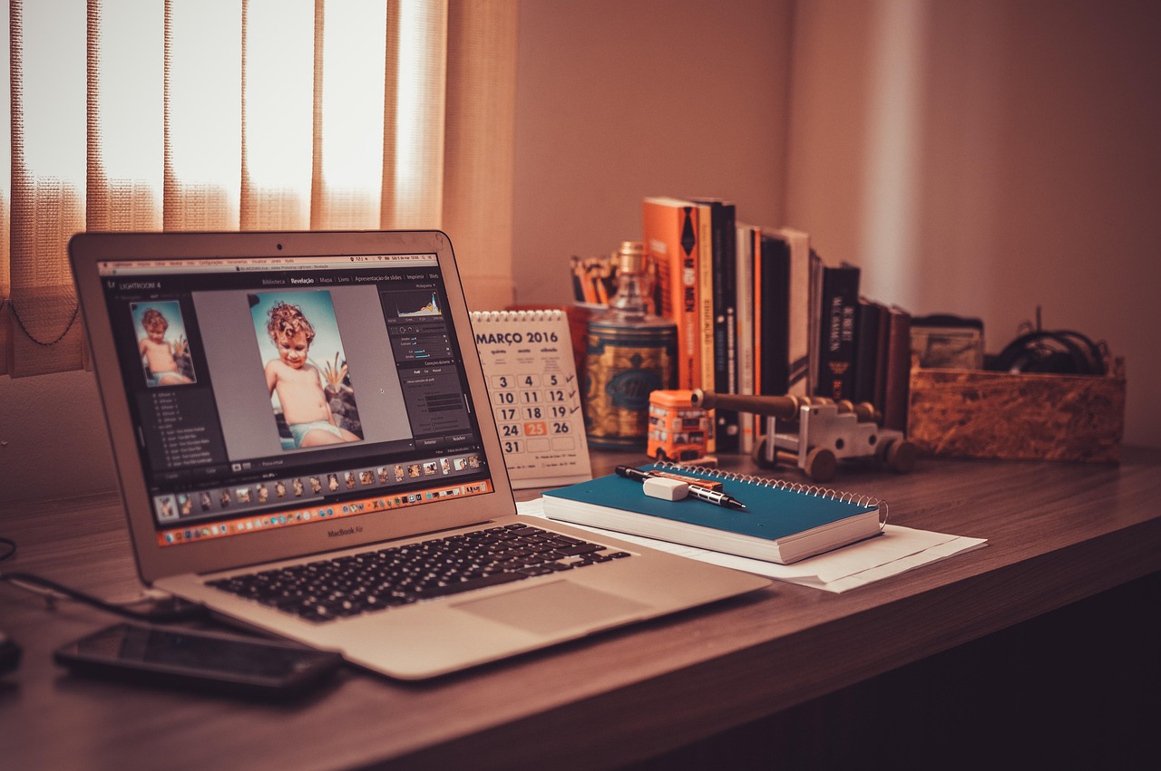 A home office desk setup with payment cards, financial notes, and budget management tools.
