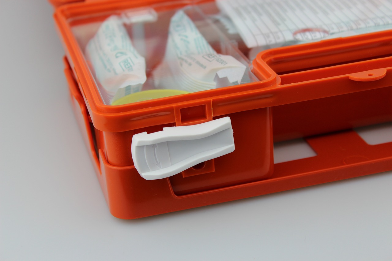 Organized home medical kit containing subcutaneous fluid bag, drip set, sterile needles, and cat treats.