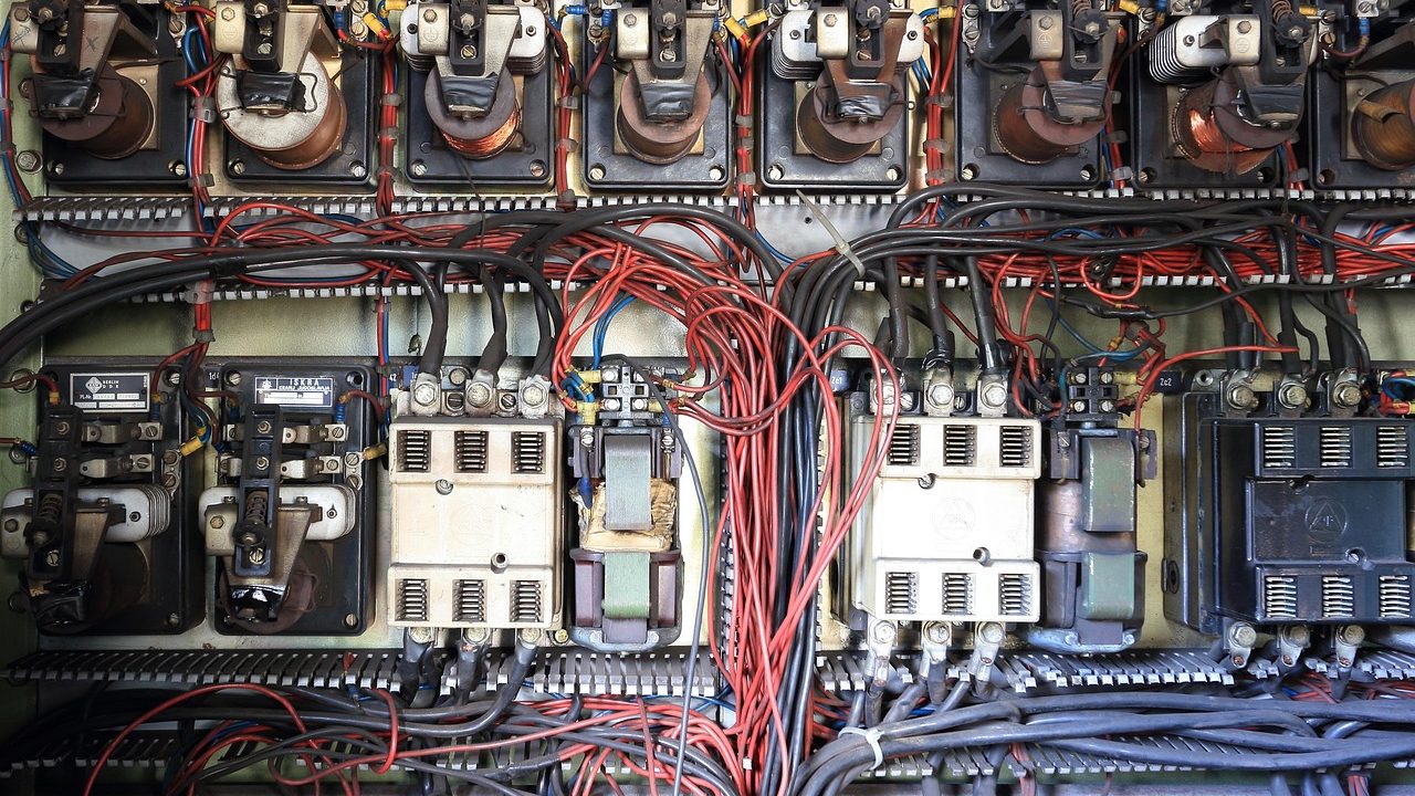 Open residential electrical service panel showing breakers, neutral wiring, and bus bar.