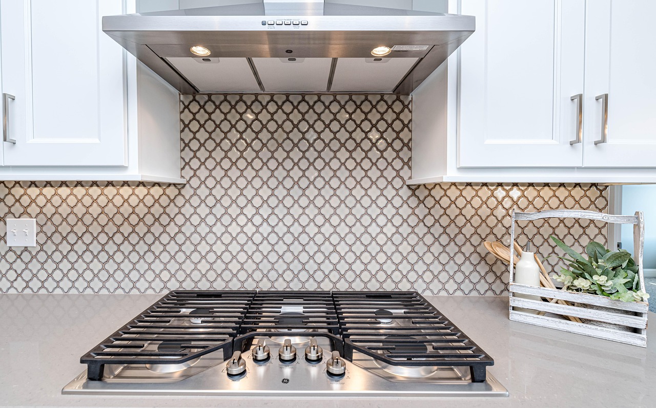 An open traditional wall oven cavity showing spacious interior racks.