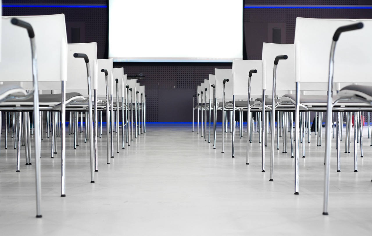 Job seeker consulting with a professional reference or mentor in a corporate conference room.