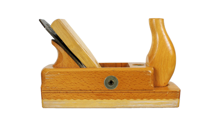 Trim carpenter measuring and cutting wood molding in a residential home.