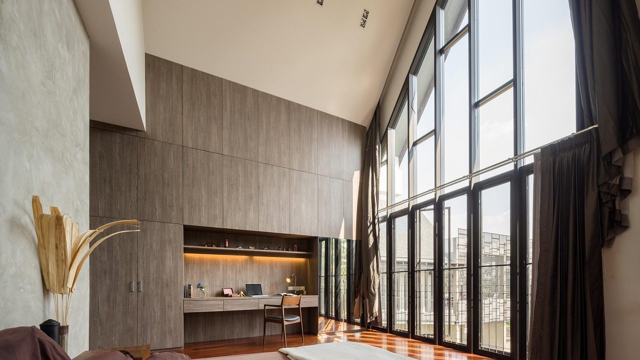 Wall-mounted ductless mini-split indoor unit in a vintage Craftsman living room.