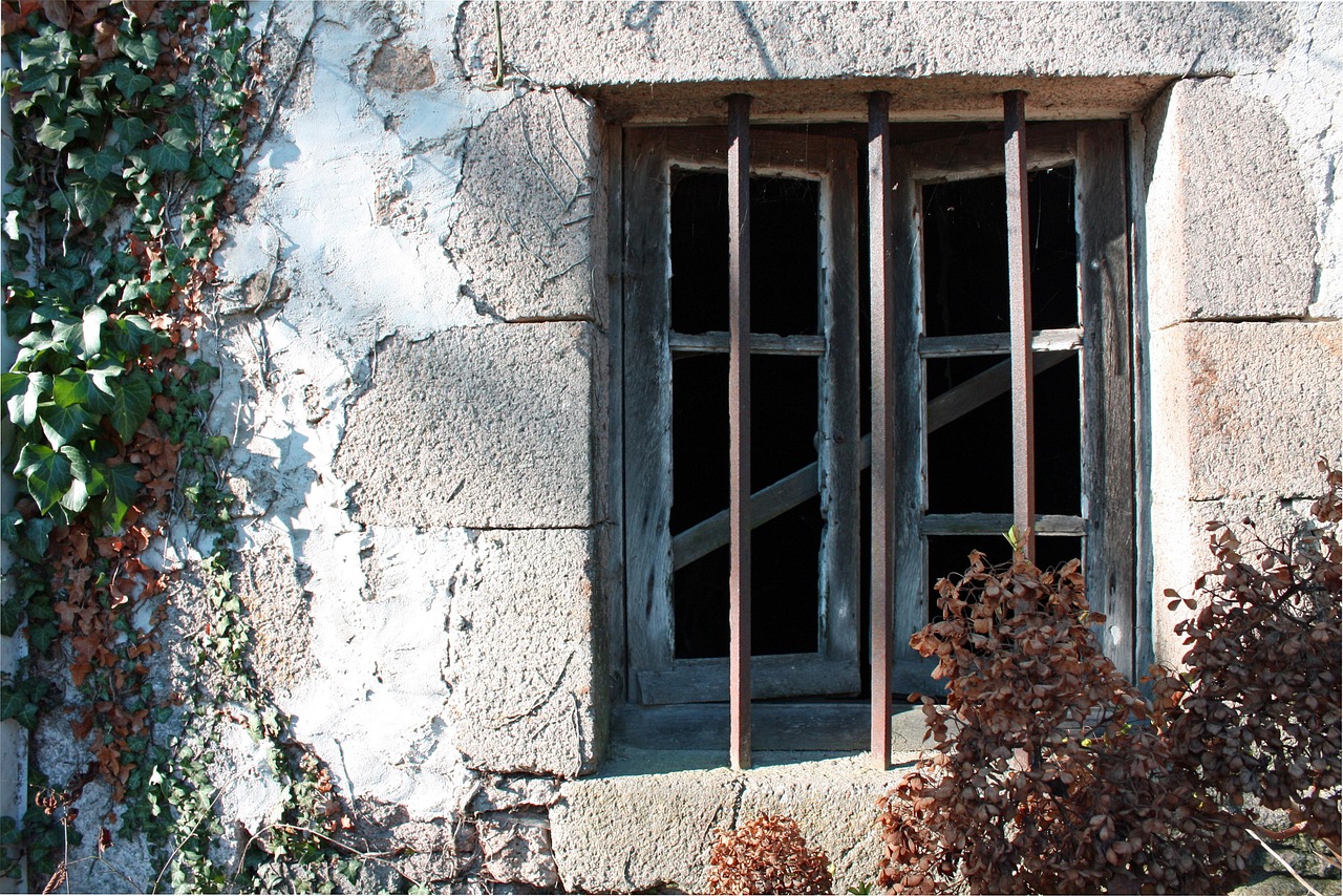 Builder measuring a window opening prior to retrofit installation.