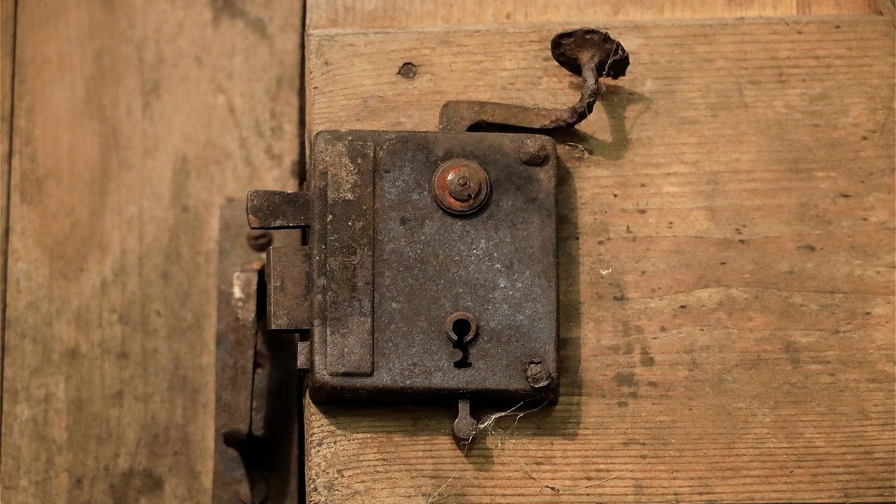 Testing a front load washer door lock switch assembly with a digital multimeter.