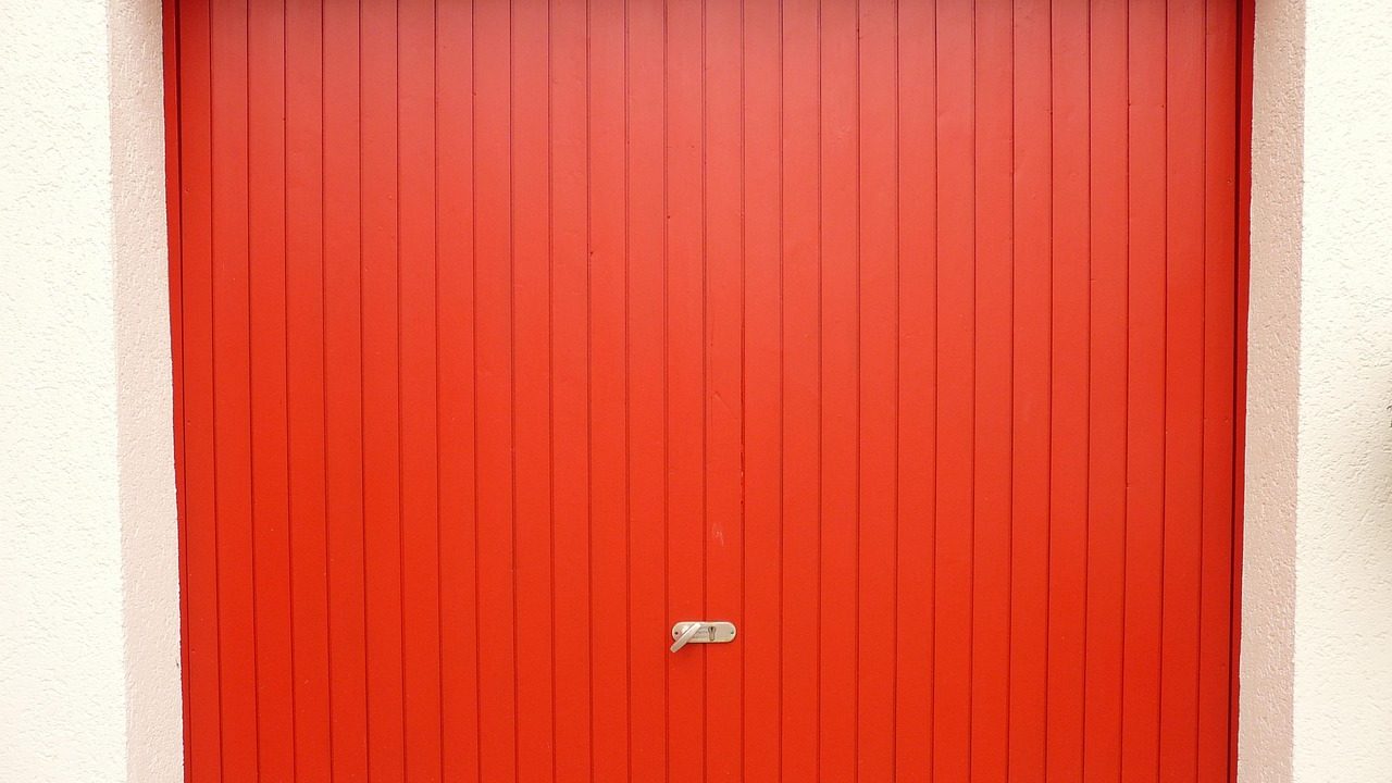 Dual garage door torsion springs mounted neatly above a residential garage door frame.