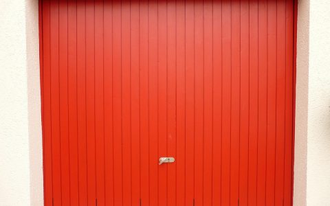 Dual garage door torsion springs mounted neatly above a residential garage door frame.