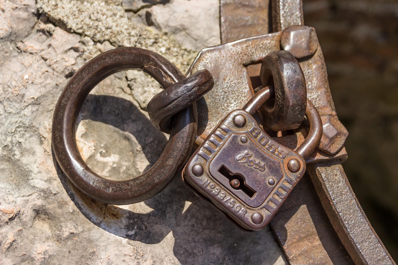 An IT administrator monitoring remote device security and encryption key status on corporate desktops.