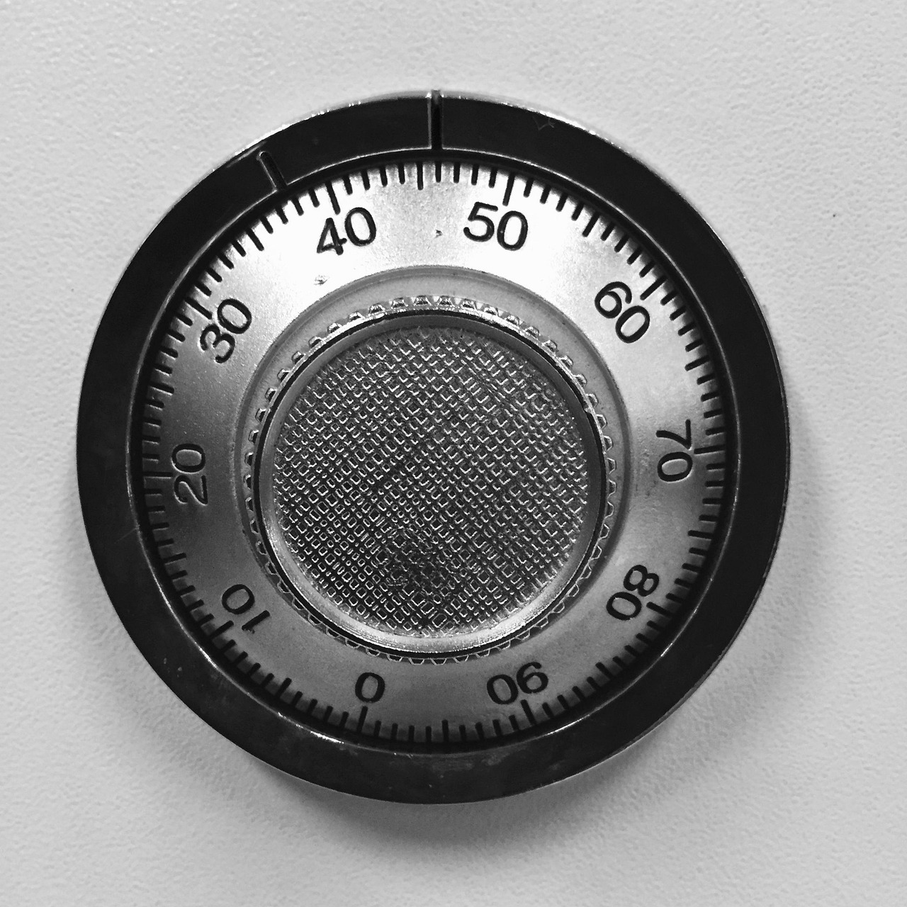A fireproof secure desktop safe containing neatly labeled hardware-encrypted USB backup drives.