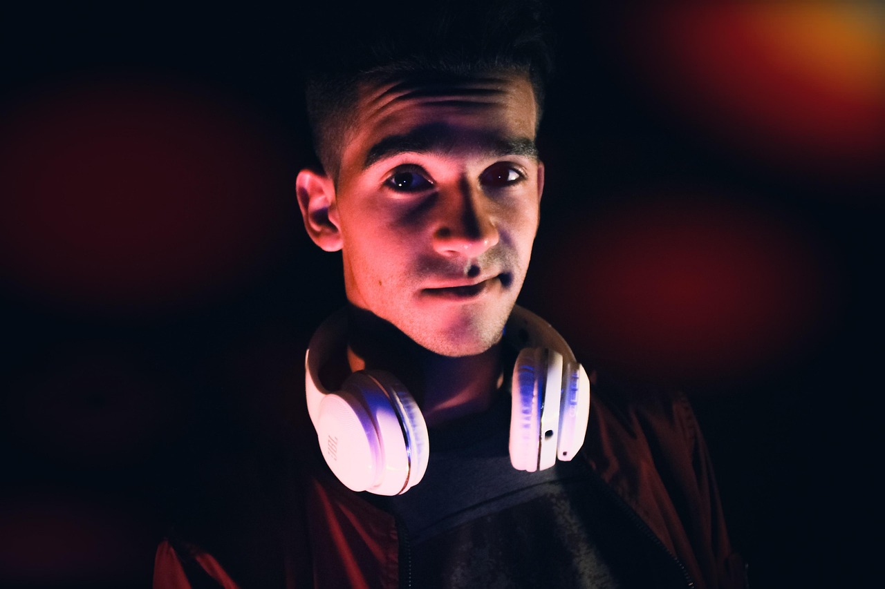 Professional wearing a headset while reviewing documents on a desk.