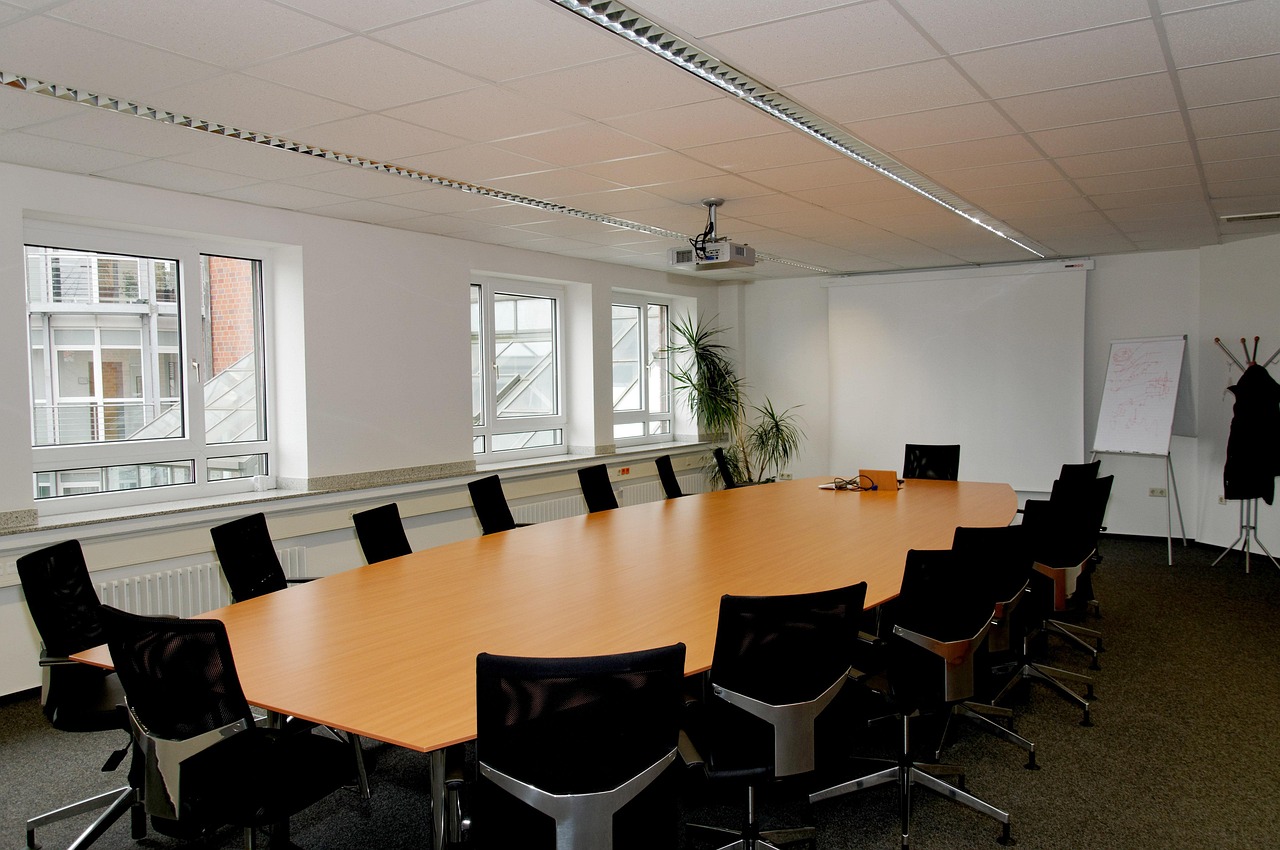 A formal administrative conference room set up for a school district committee meeting.