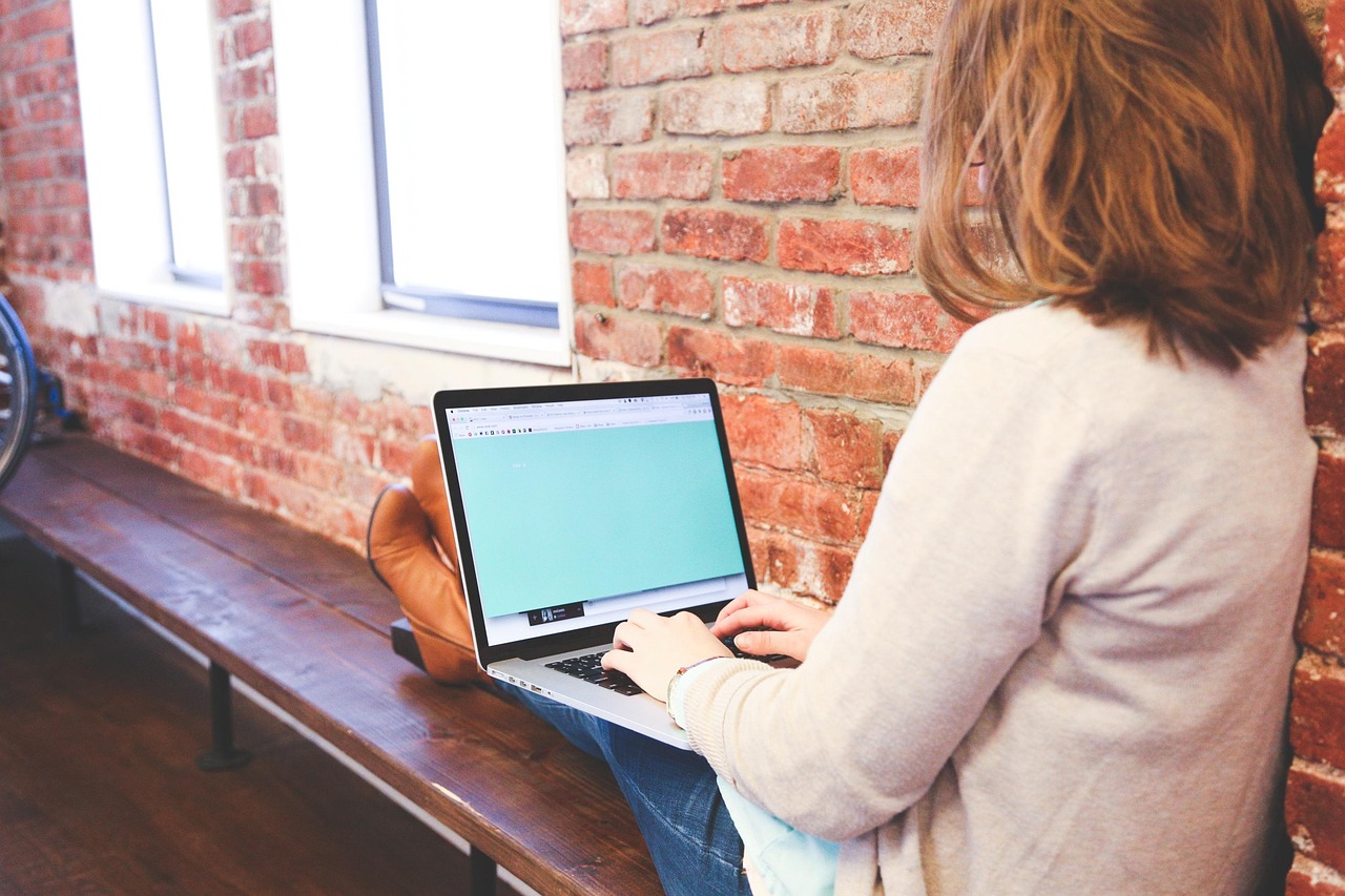 A high school student working on medical homebound coursework at home on a laptop.