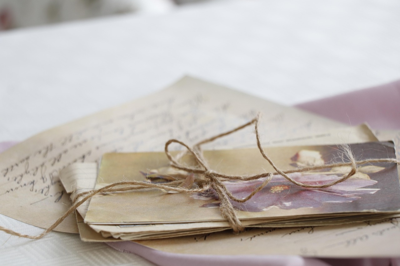 A formal appeal letter and printed administrative forms on a desk next to a pen.