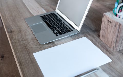 Professional reviewing workplace leave documentation at an office desk