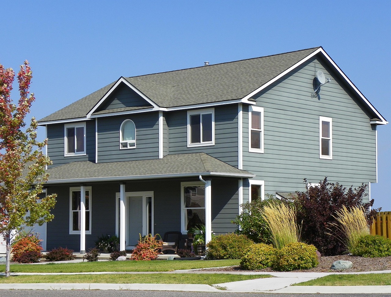 Suburban American house representing an inherited family real estate asset subject to appraisal or sale.
