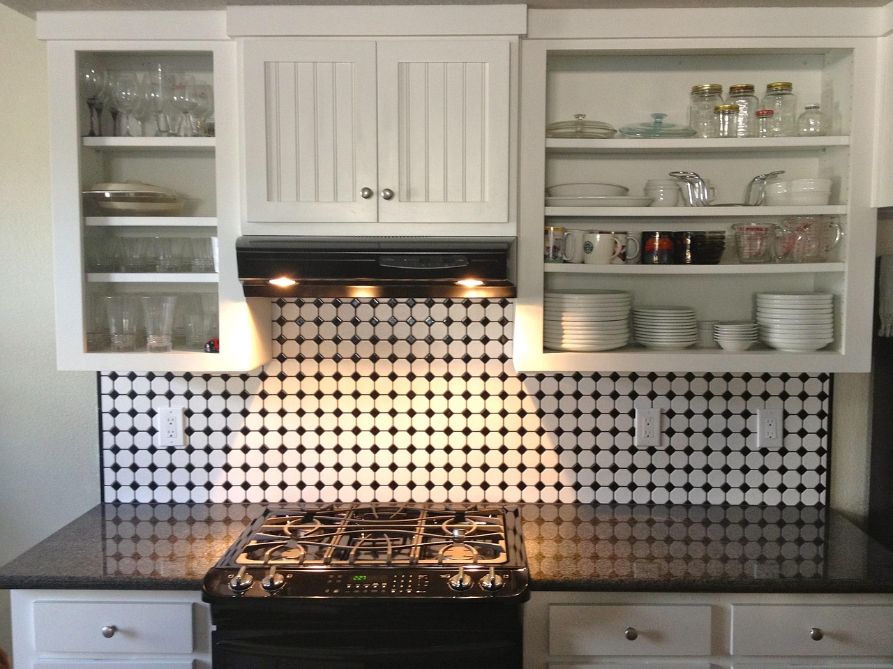 New hinges and handles installed on updated kitchen cabinets