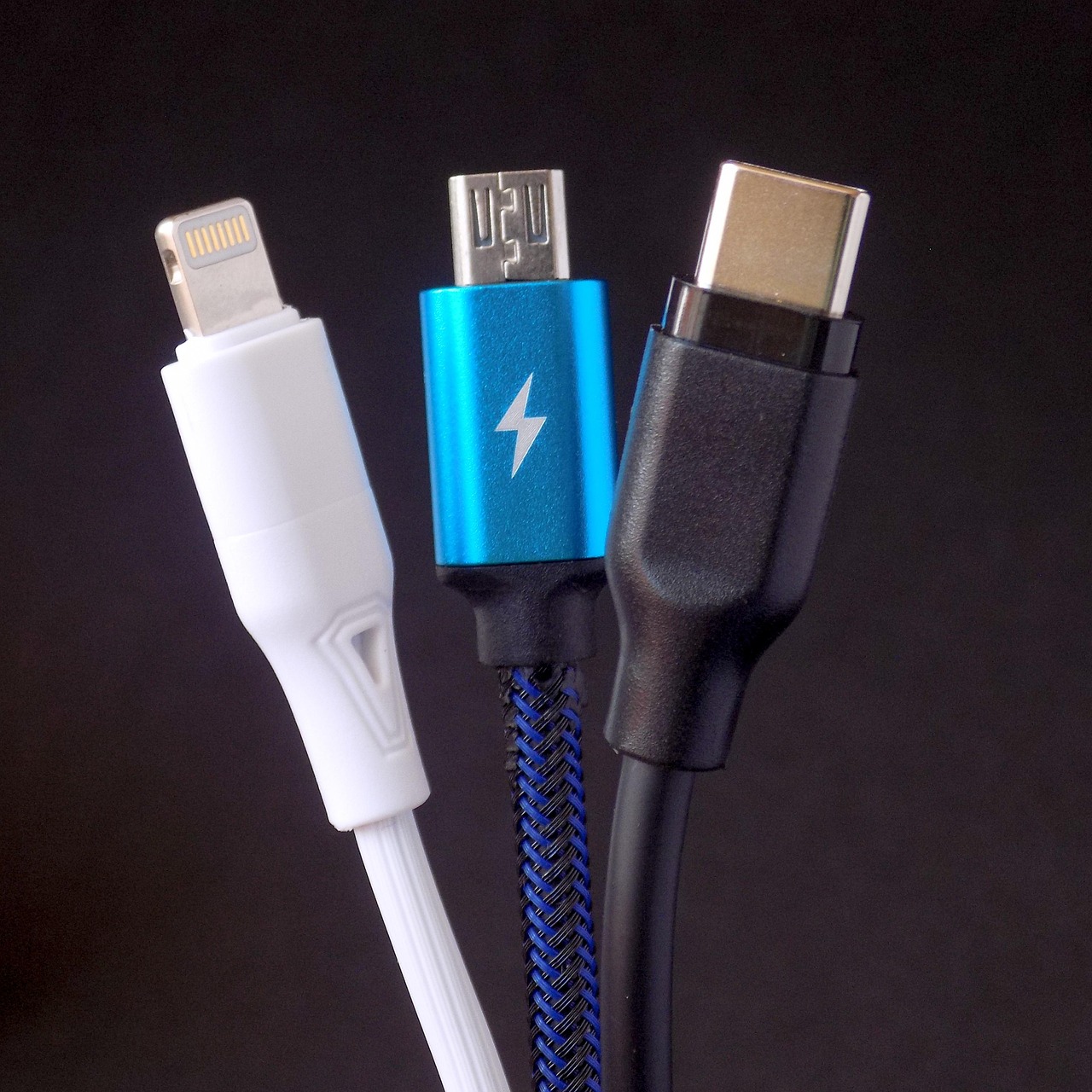 Utility bills, USB drive with video evidence, and administrative claim documents arranged on a desk.