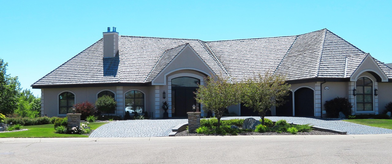 A close-up shot of a modern residential permeable paver driveway designed for stormwater drainage.