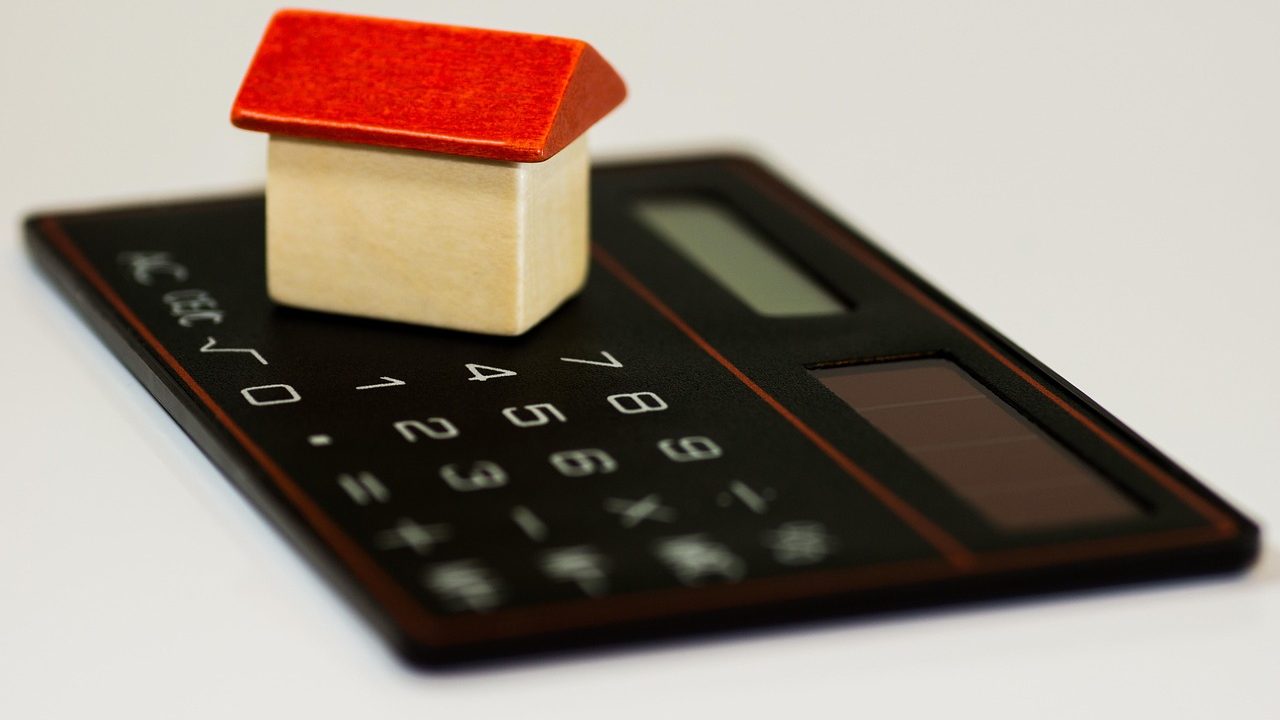 A close-up shot of an itemized natural gas utility bill next to a calculator.