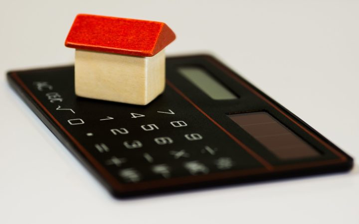 A close-up shot of an itemized natural gas utility bill next to a calculator.