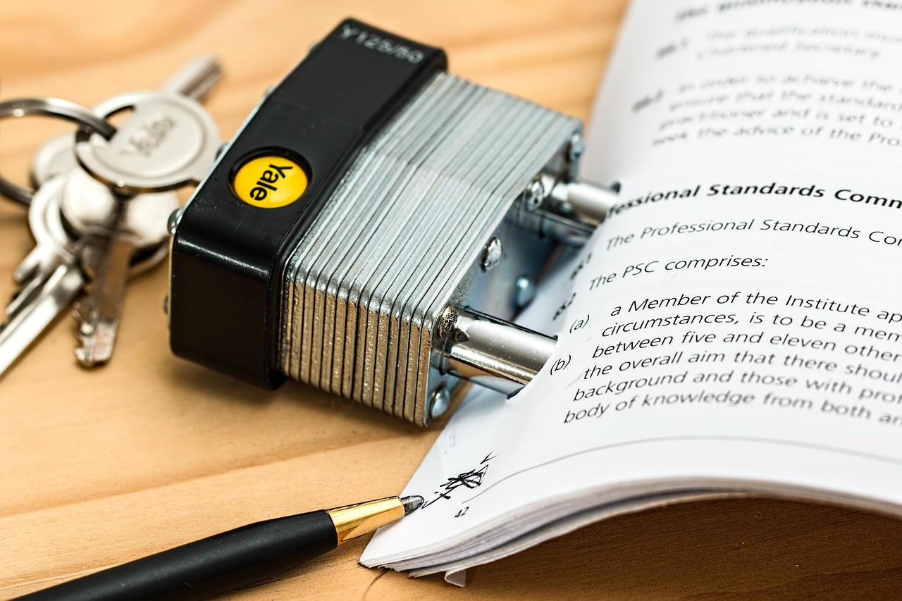 Legal documents and a fountain pen resting near a geographic map visual.