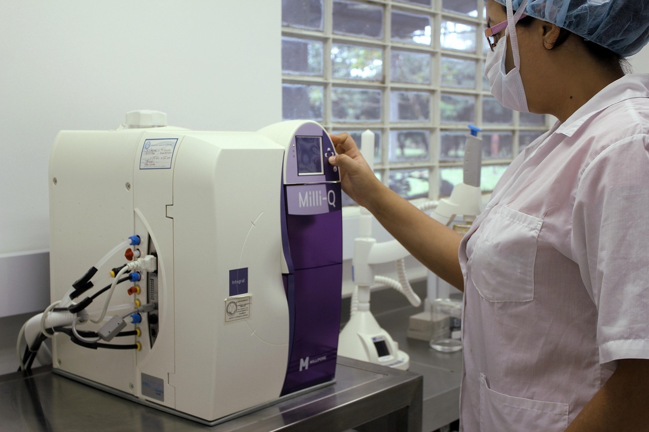 A gemologist examining a loose diamond under a laboratory microscope.