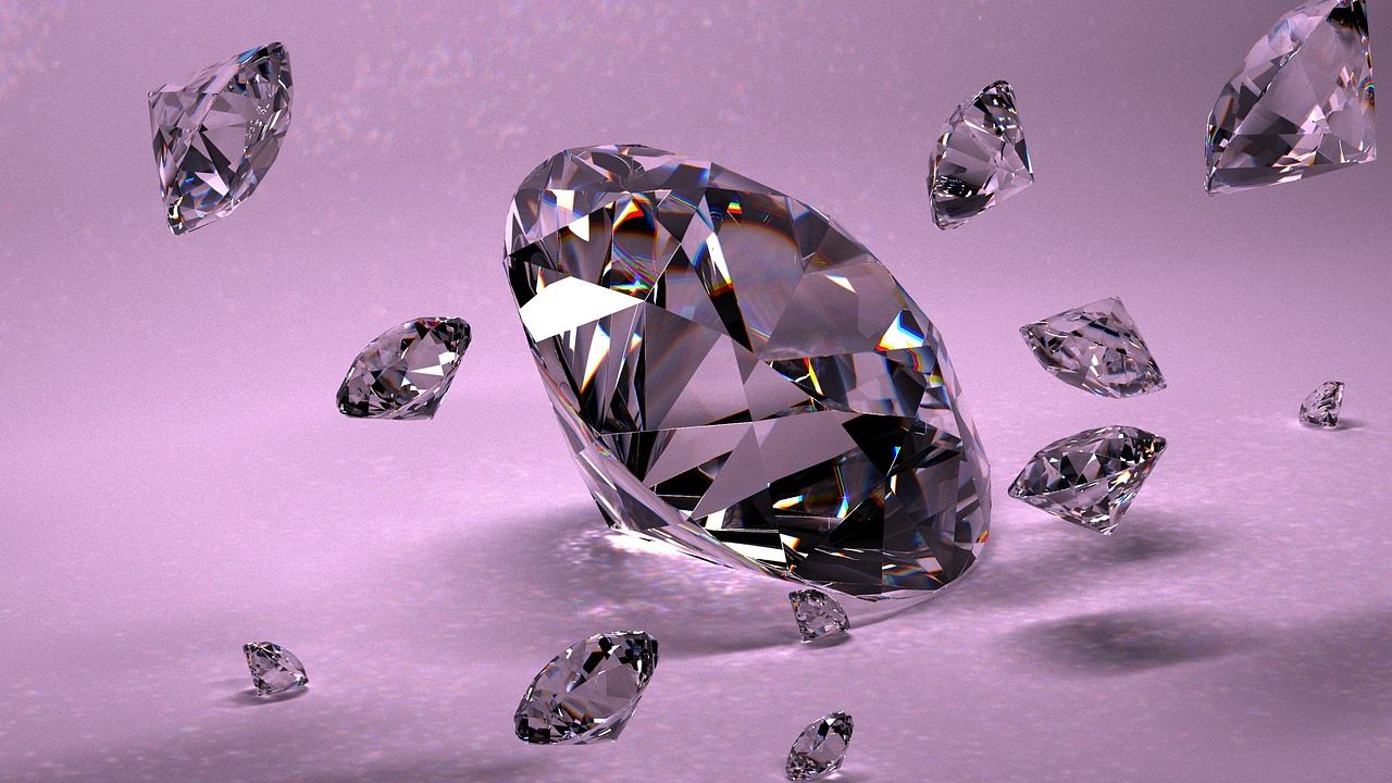 A brilliant-cut diamond sitting next to a gemological lab report and jeweler loupe.