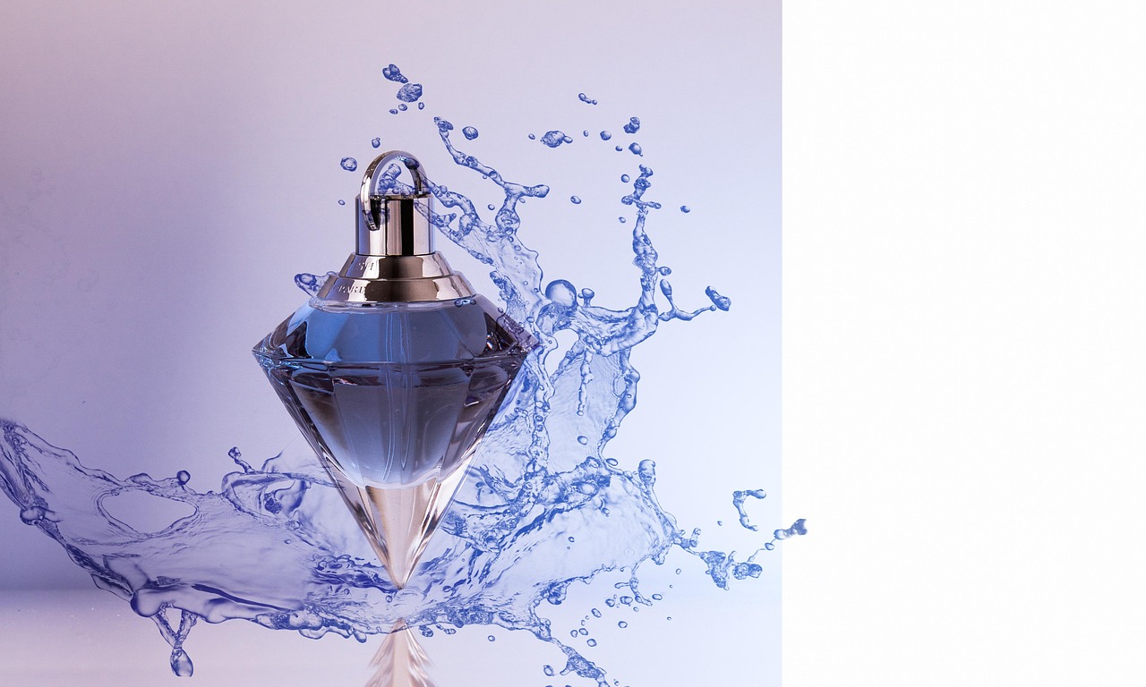 A minimalist fragrance tester box and bottle on a clean surface.