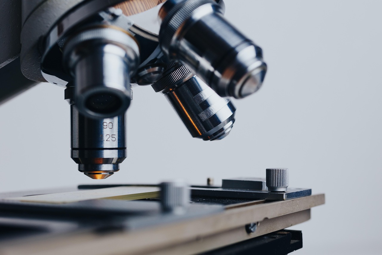 Gemologist evaluating an estate diamond under a laboratory microscope
