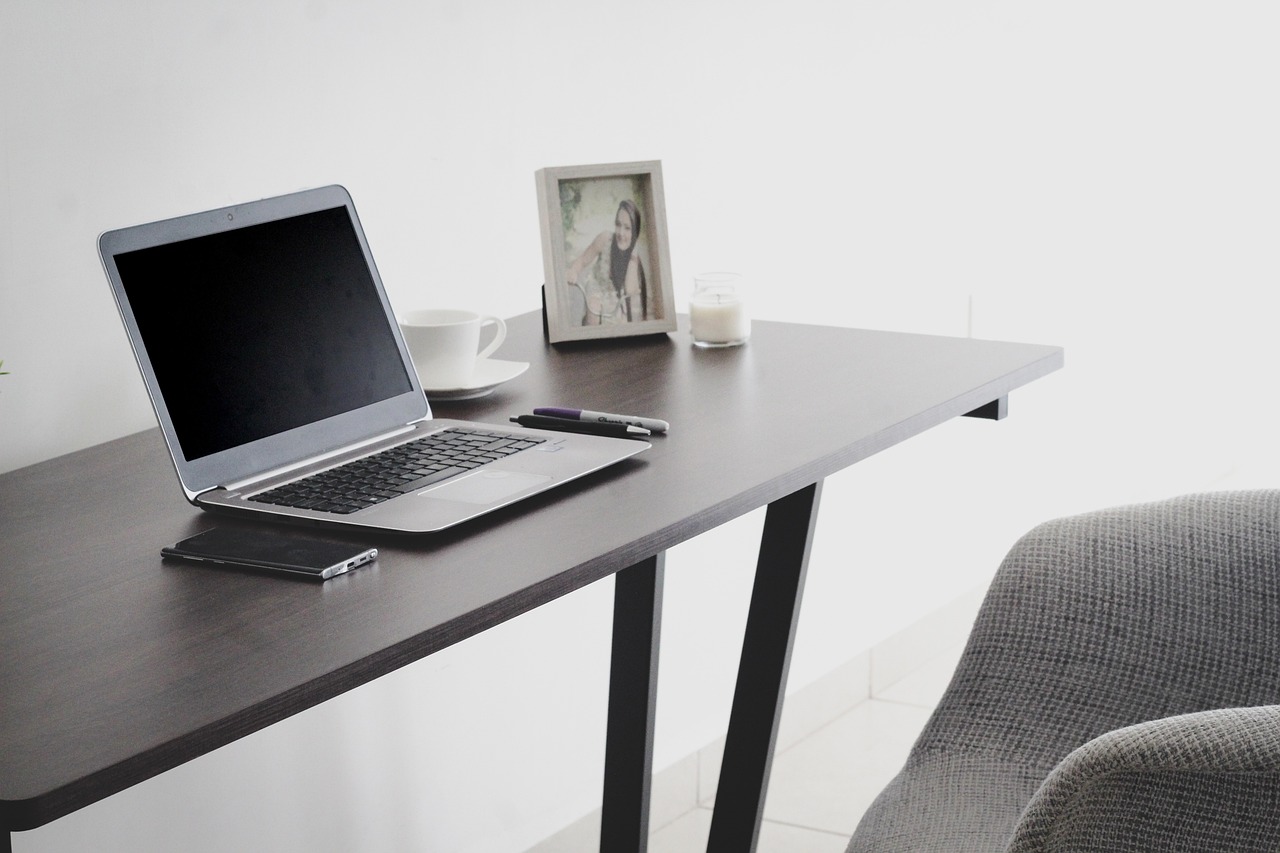 A home reseller's workstation equipped with testing tools, packaging materials, and inventory management software.