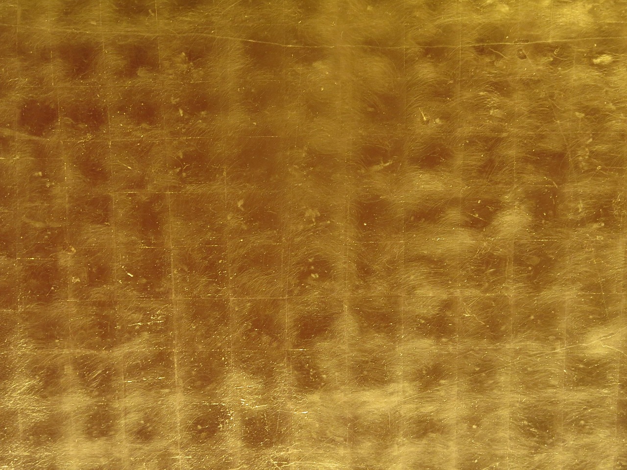 XRF spectrometer testing the metallurgical purity of gold metal non-destructively.