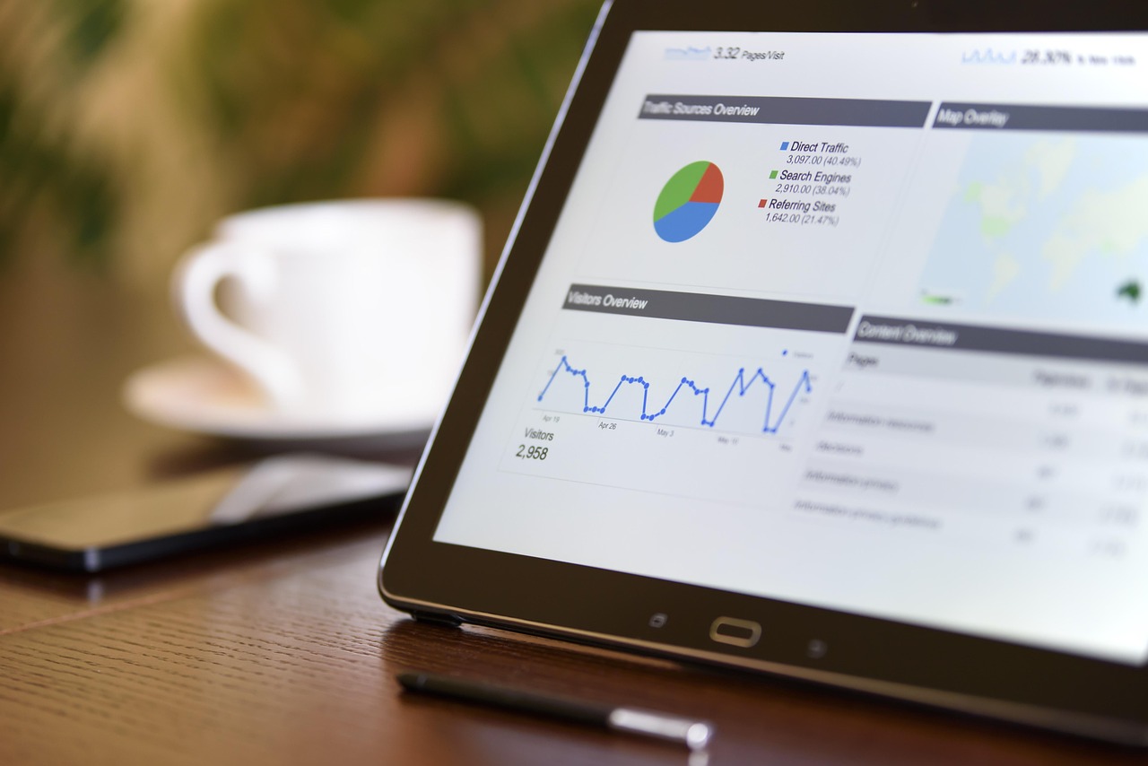 Neatly organized file archive alongside a digital tablet symbolizing plain-text knowledge organization.