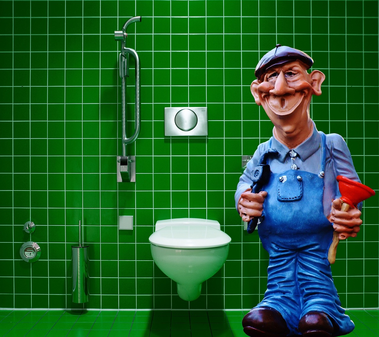 Plumber using an electrical expansion tool to attach a PEX-A expansion ring to a fitting in open wall studs.