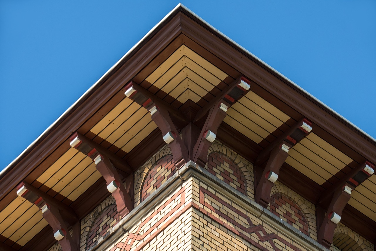 Steel temporary shoring post supporting a porch roof during column replacement