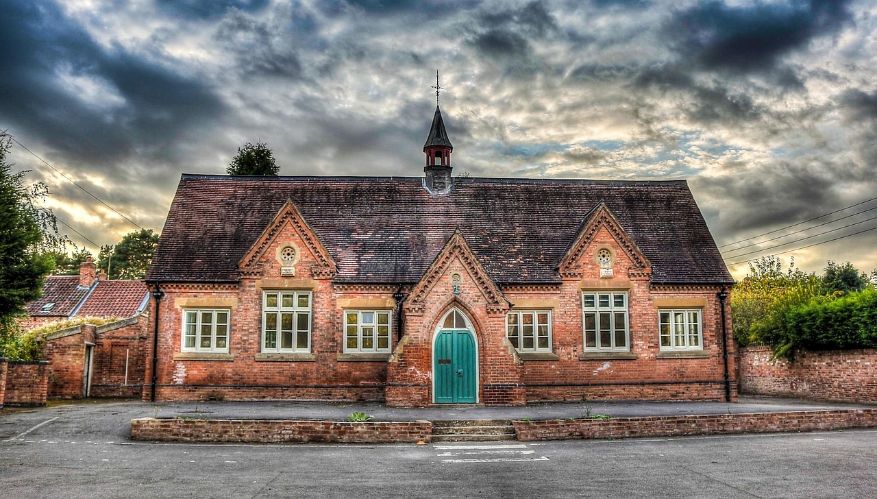 Exterior view of a suburban public school building during daylight.