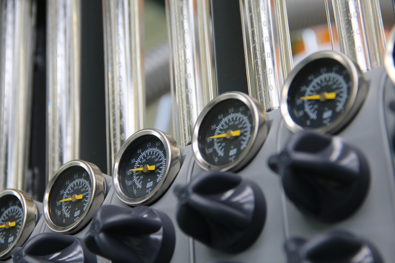 Close-up of a U-tube manometer showing fluid levels indicating system pressure.