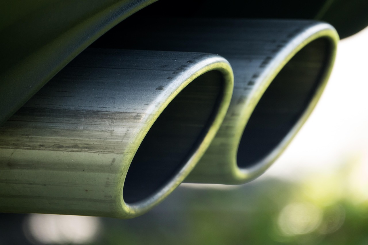 PVC radon exhaust pipe extending above the roofline of a residential home.