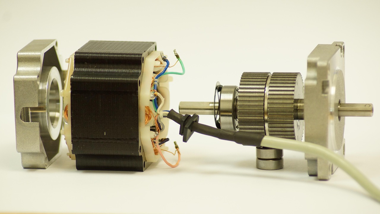 Exposed refrigerator evaporator coils and fan motor inside a freezer compartment
