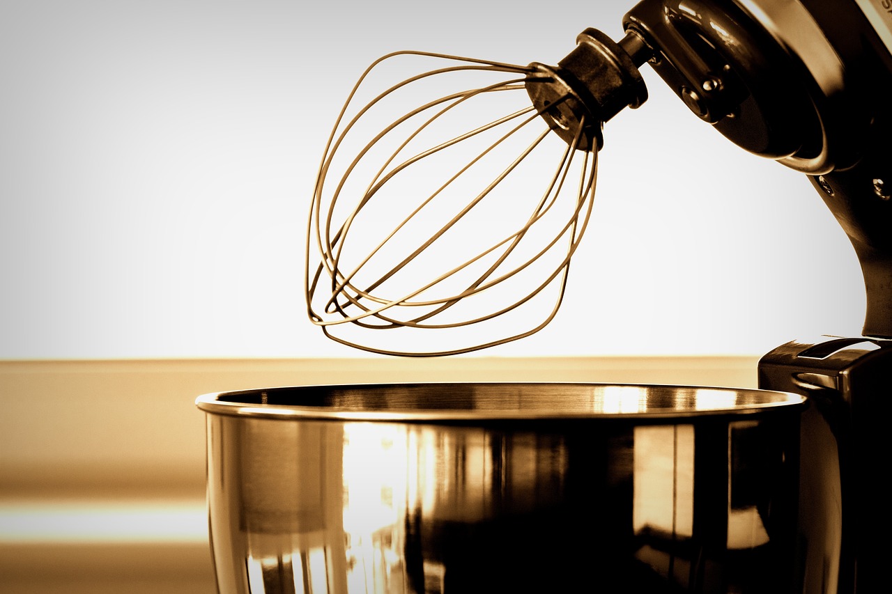 A close-up view of a heavy-duty food processor motor base with internal components exposed.