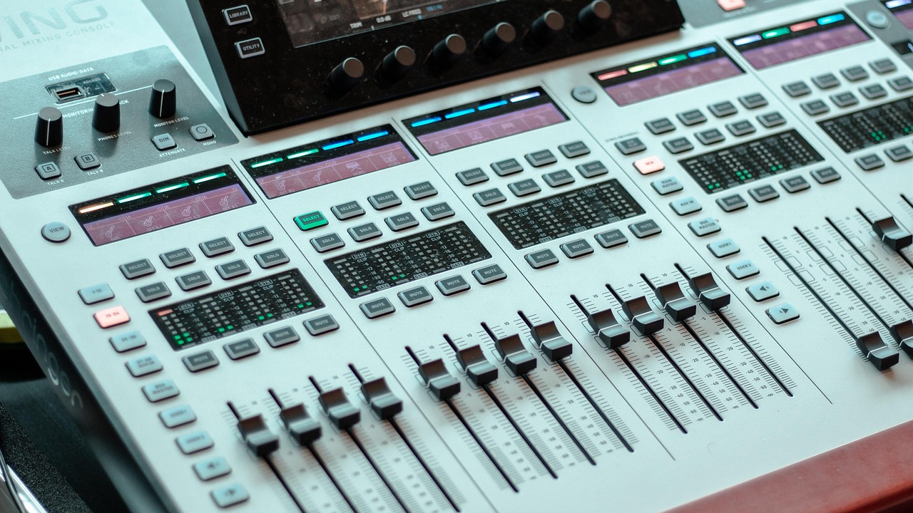 Close-up of sliders, dials, and LED screens on a modern digital piano control panel.