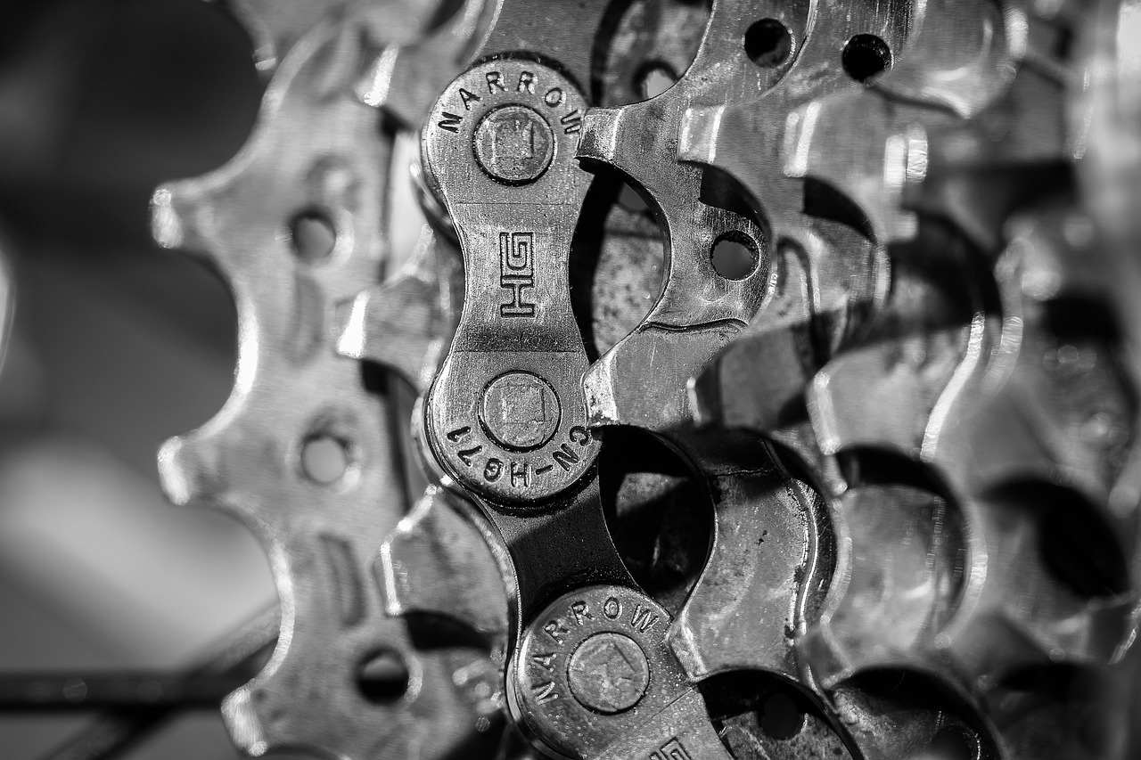 Exposed internal planetary gears of a countertop mixer undergoing mechanical inspection.