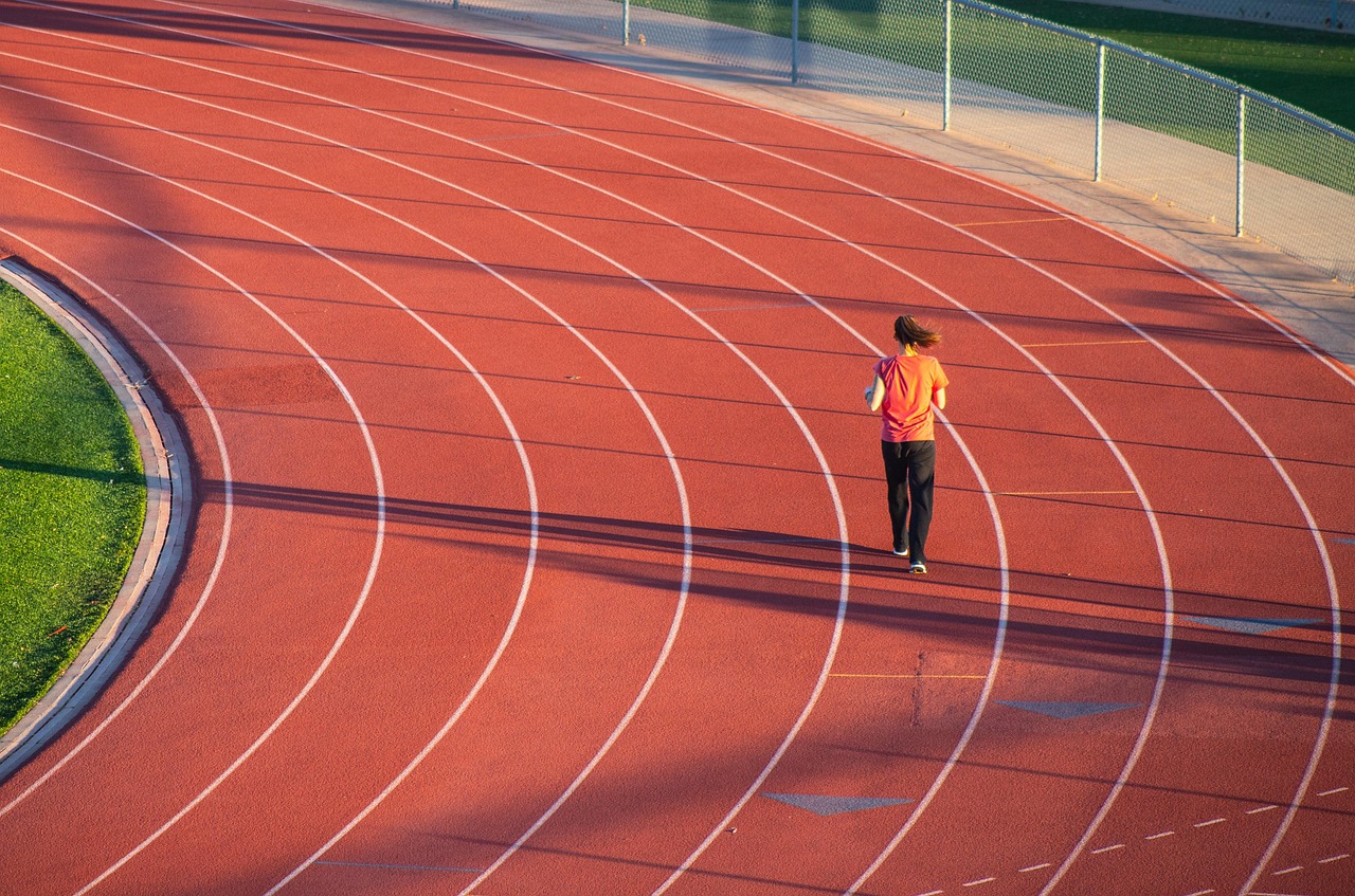 Runner checking metrics on a fitness tracker outdoors